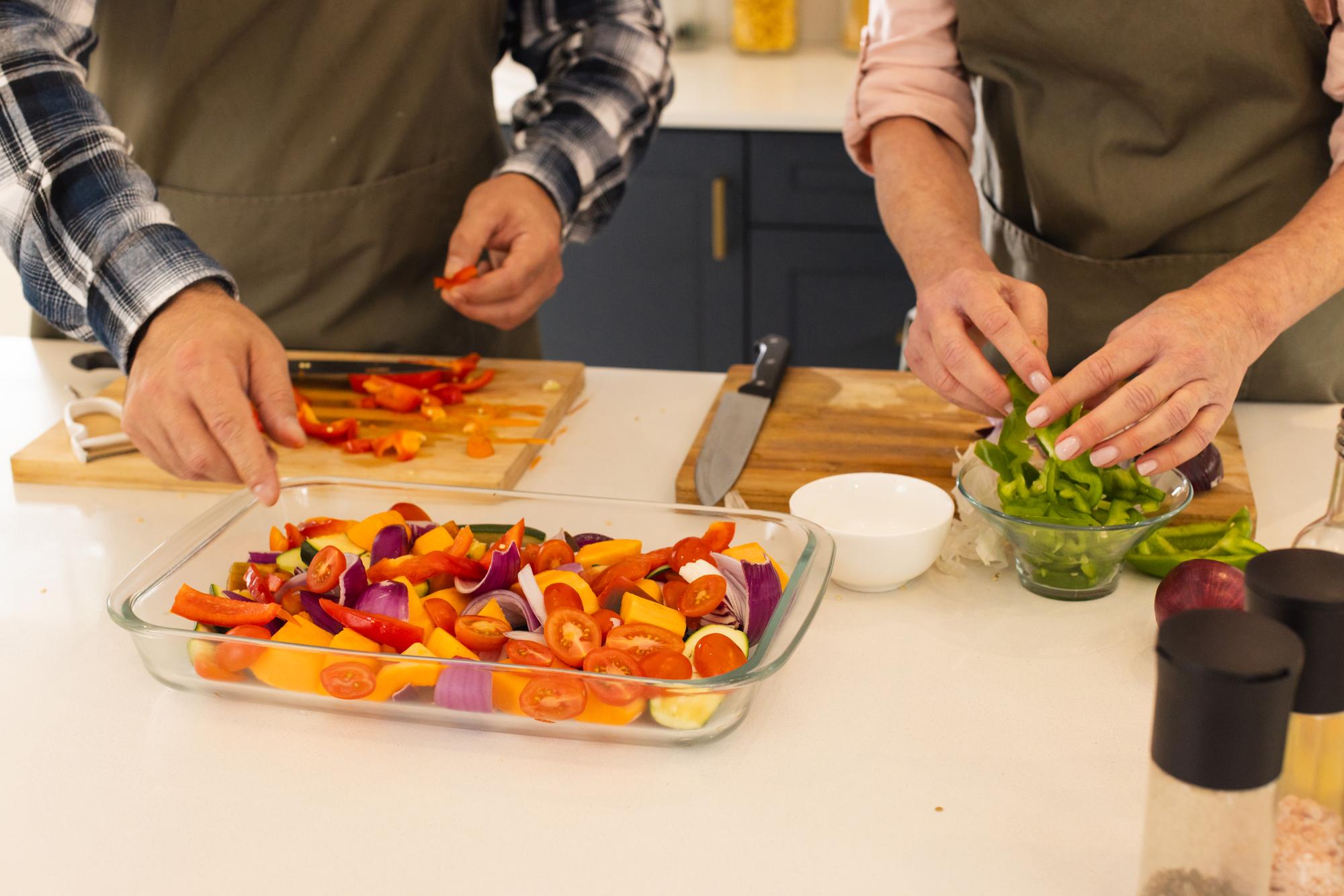 small team prepping recipes together in bright kitchen